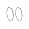 Umlaut Half Diamond Huggie Earrings – product view